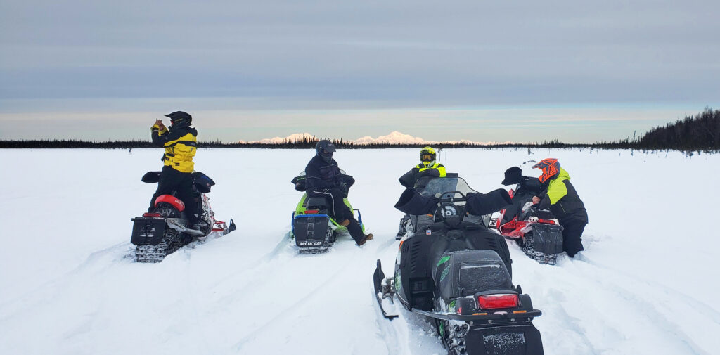 Rediscover your passion for adventure on a wilderness Alaska snowmobile tour, the ride of a lifetime with Alaska Adventure Guides.